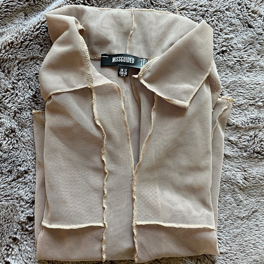 Mesh exposed seam top